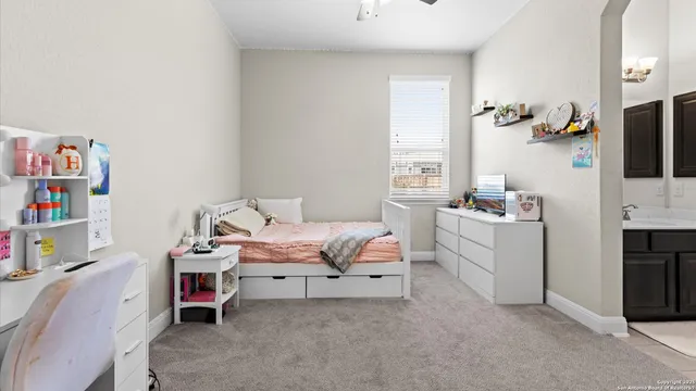 a bedroom with a workspace