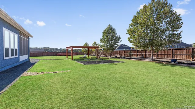a view of a house with a yard porch and sitting area