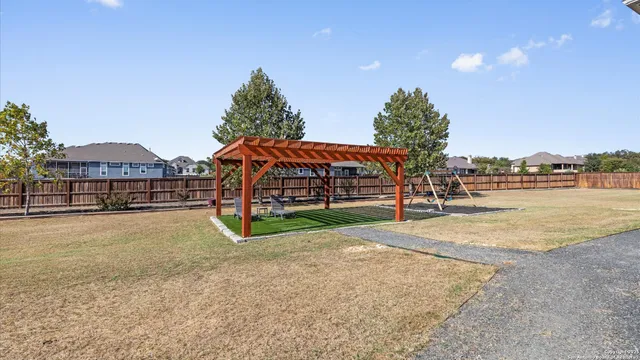a view of multiple houses with a yard