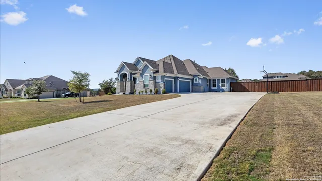 a view of swimming pool with outdoor seating and yard in the back