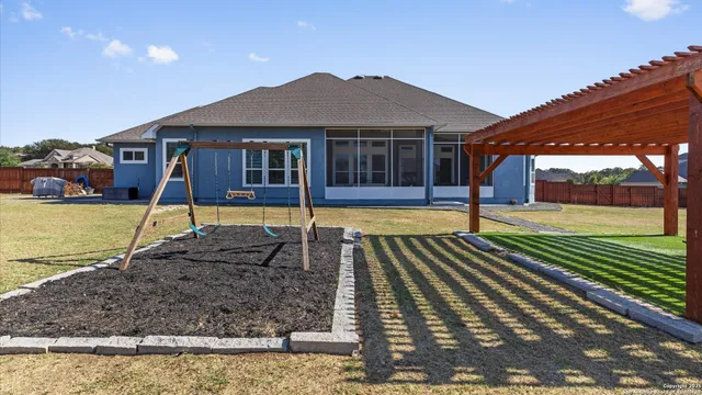 a view of swimming pool with seating area
