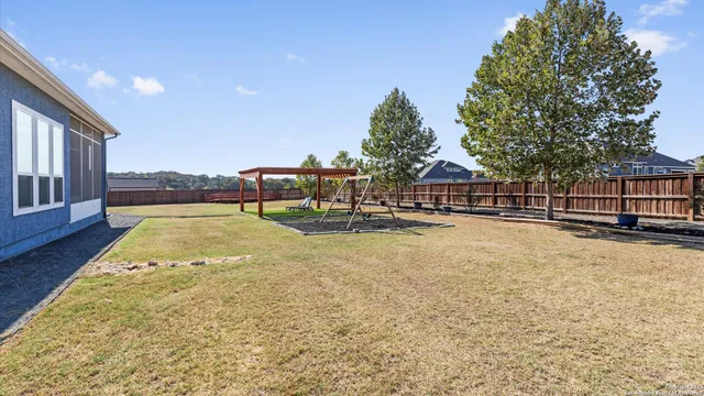 an aerial view of a house with parking space