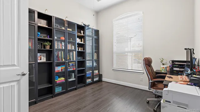 a living room with furniture and a mirror