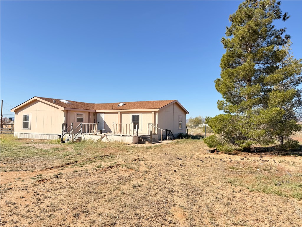 5495 Destiny Way Golden Valley, AZ 86413 - Photo 1 of 48 a large house with a large tree in front of it