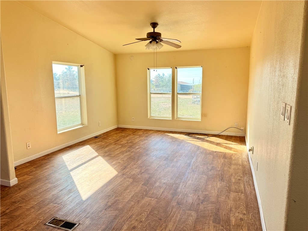 5495 Destiny Way Golden Valley, AZ 86413 - Photo 11 of 48 an empty room with wooden floor and windows