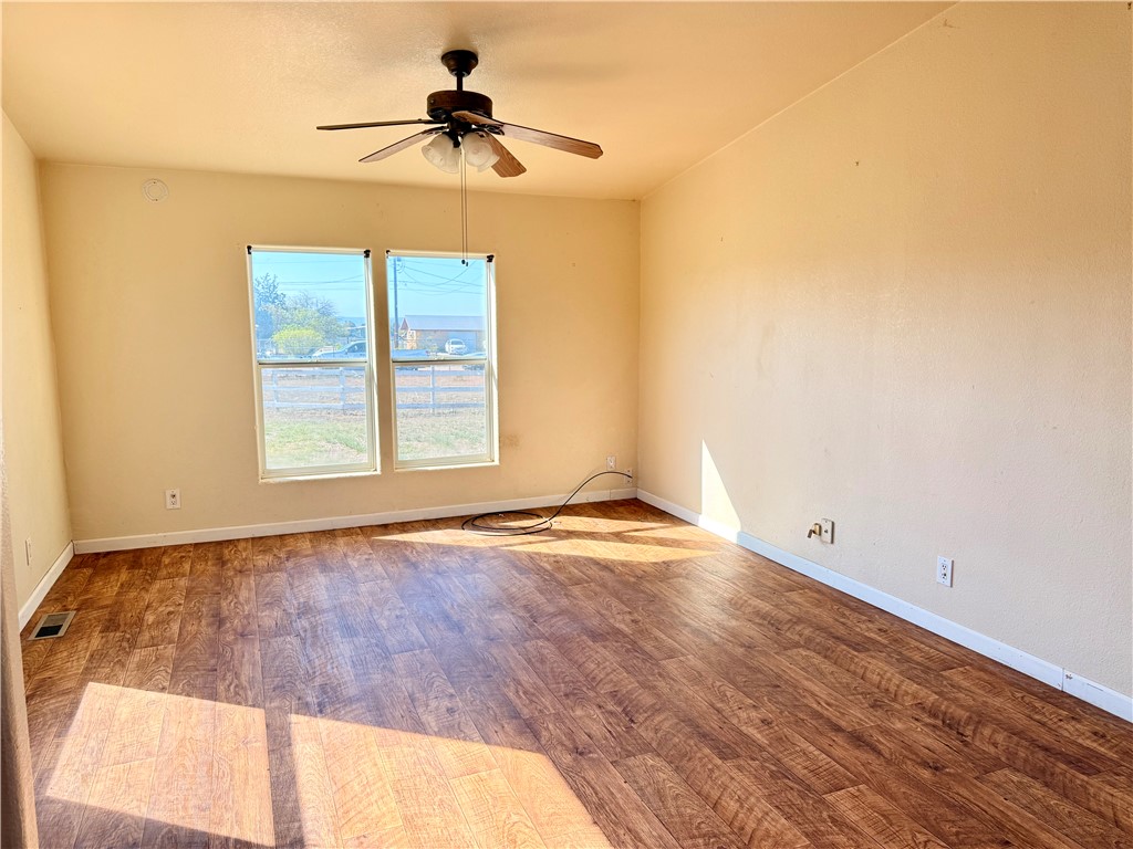 5495 Destiny Way Golden Valley, AZ 86413 - Photo 12 of 48 an empty room with a window and a ceiling fan