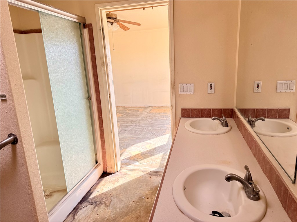 5495 Destiny Way Golden Valley, AZ 86413 - Photo 15 of 48 a bathroom with a sink and a mirror