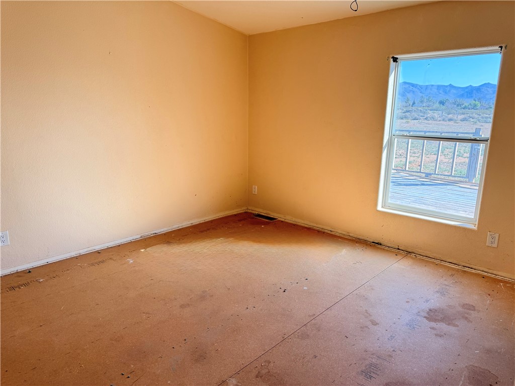 5495 Destiny Way Golden Valley, AZ 86413 - Photo 18 of 48 an empty room with windows