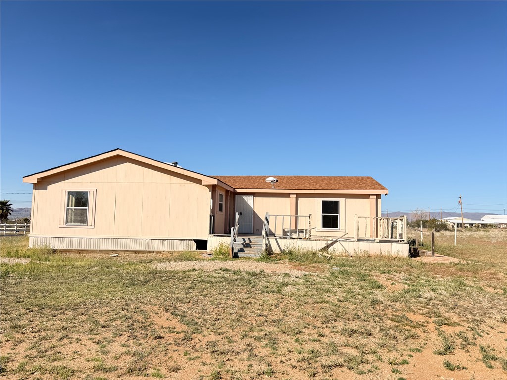 5495 Destiny Way Golden Valley, AZ 86413 - Photo 25 of 48 a view of a house with a yard