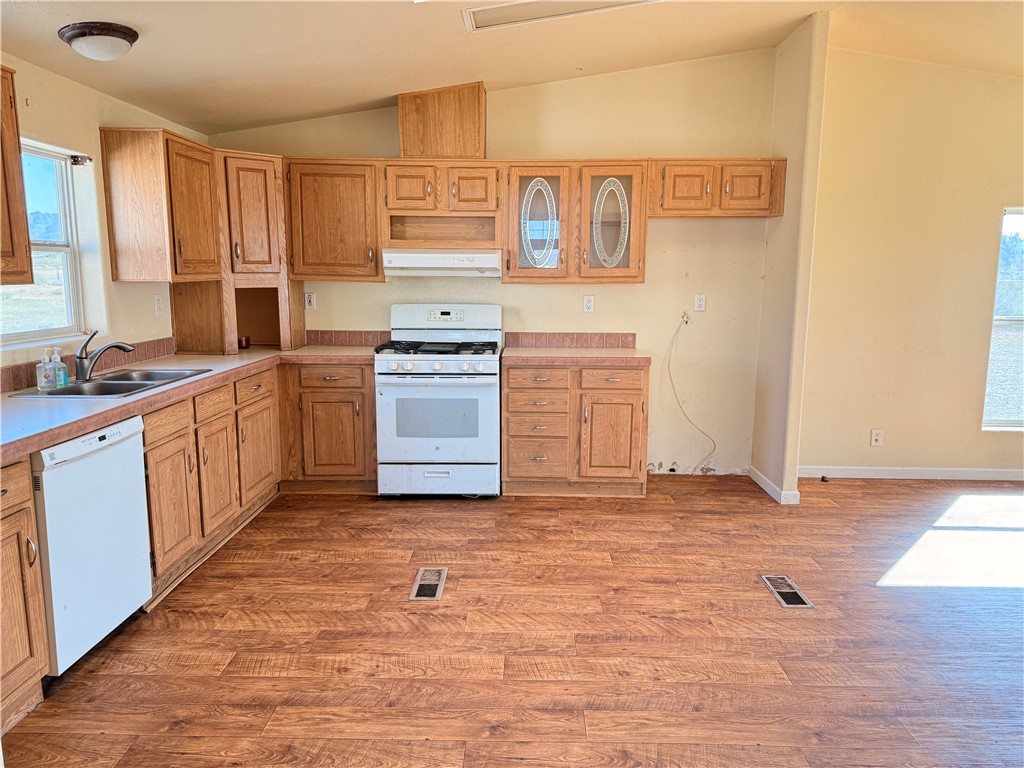 5495 Destiny Way Golden Valley, AZ 86413 - Photo 10 of 48 a kitchen with stainless steel appliances a sink and cabinets