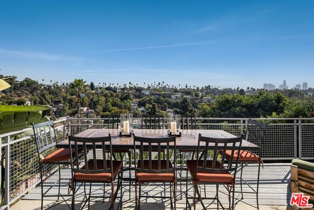 a view of a chairs and table on the terrace