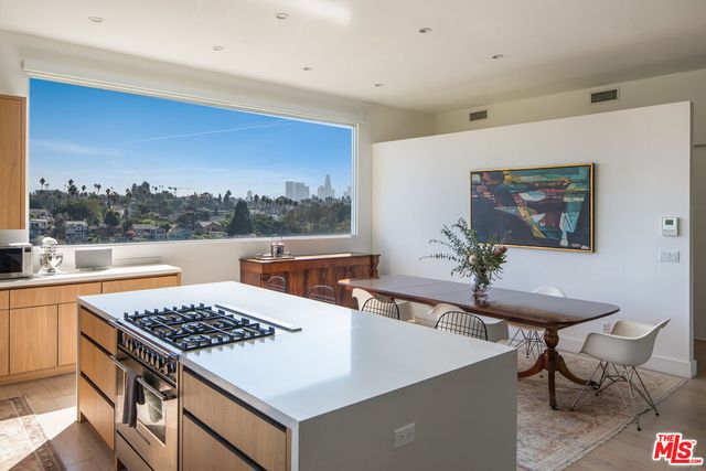 a very nice looking dining room with a table and chairs