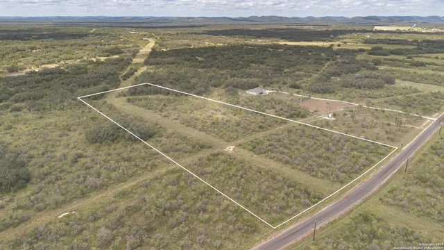 a view of a swimming pool and an outdoor space