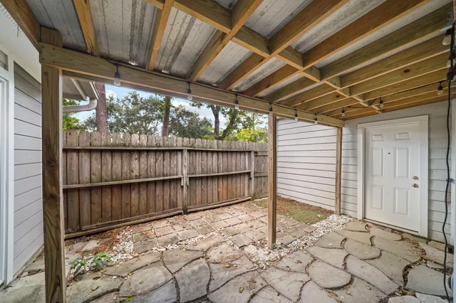 a view of a backyard with wooden floor