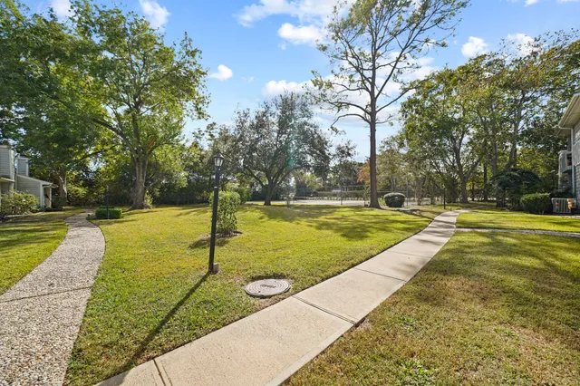 a view of a house with a yard and garage