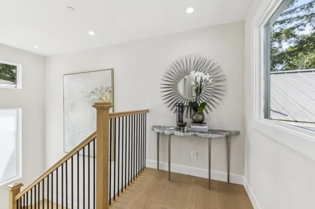 a bedroom with a bed a couch and a window