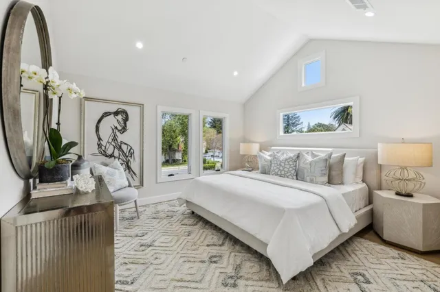 a bathroom with a double vanity sink mirror and