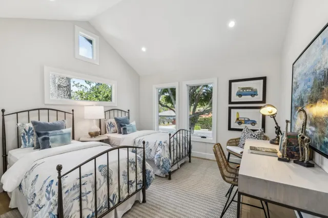 a bathroom with a double vanity sink mirror and toilet