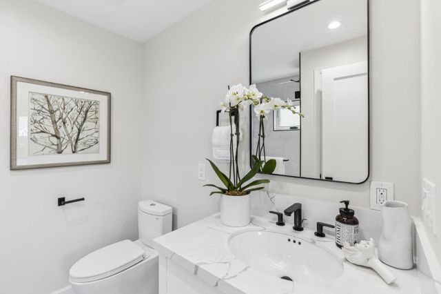 a spacious bedroom with a bed and window