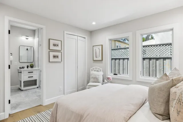 a bathroom with a sink a vanity a mirror and a shower