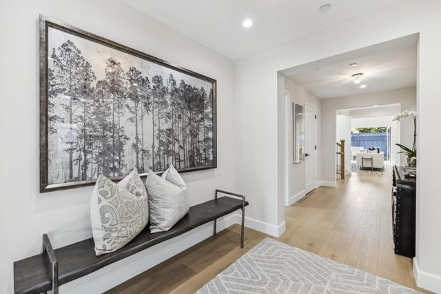 a living room with fireplace furniture and a fireplace