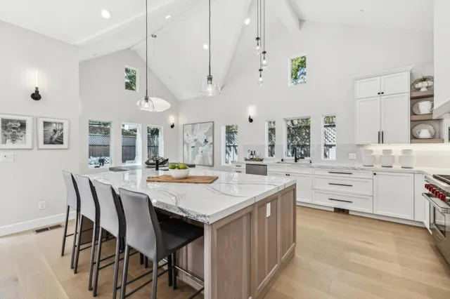 a kitchen with stainless steel appliances and white cabinets