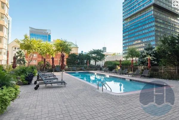 a view of a swimming pool with a patio