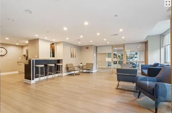 a living room with furniture and a table