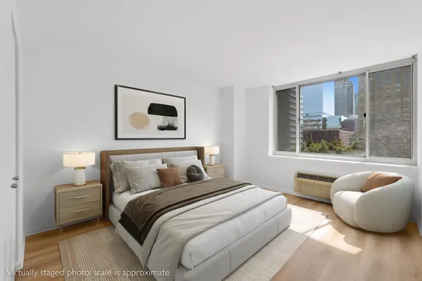 a bedroom with a bed and window