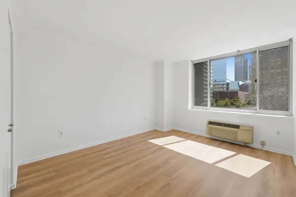 a view of an empty room with a window