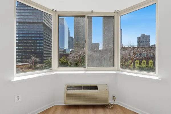 a view of a door and a window in an empty room