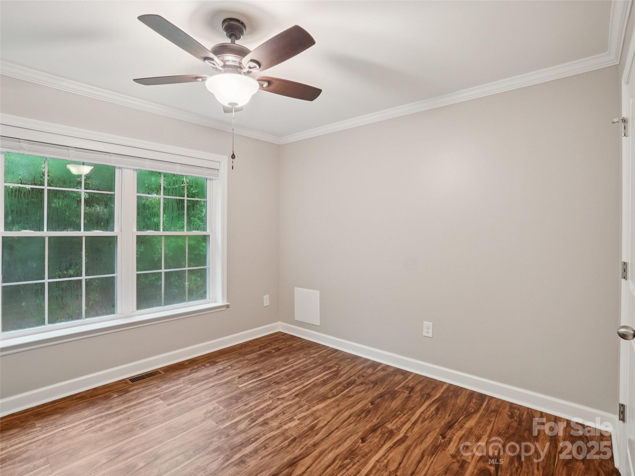 32 Lewis Street Canton, NC 28716 - Photo 14 of 27 wooden floor in an empty room with a window