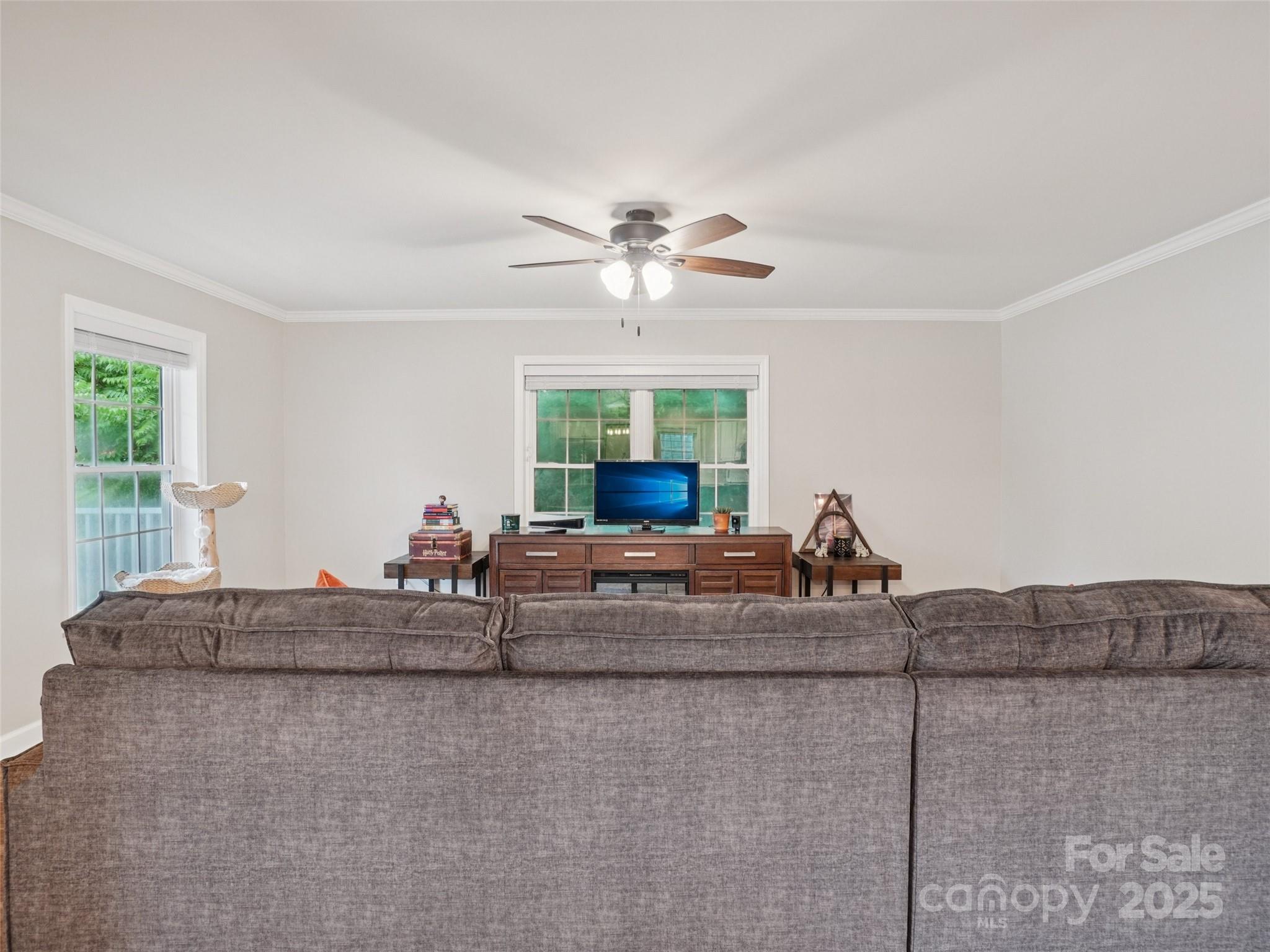 32 Lewis Street Canton, NC 28716 - Photo 8 of 27 a living room with furniture and a chandelier