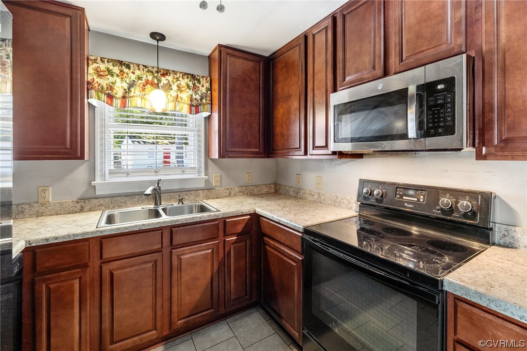 9303 Edson Road Henrico, VA 23229 - Photo 11 of 20 a kitchen with a sink stove and microwave