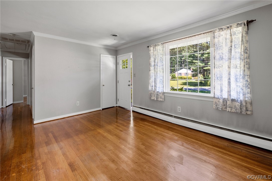 9303 Edson Road Henrico, VA 23229 - Photo 6 of 20 a view of an empty room with wooden floor and a window