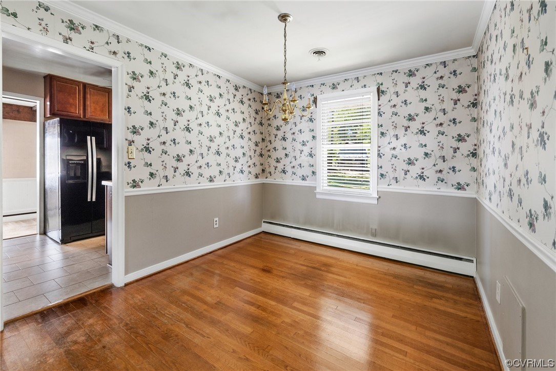9303 Edson Road Henrico, VA 23229 - Photo 8 of 20 a view of empty room with wooden floor and fan