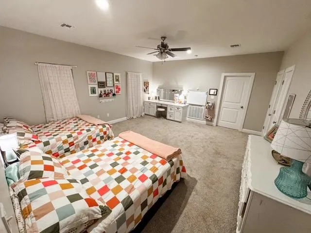 a bedroom with a bed and a couch