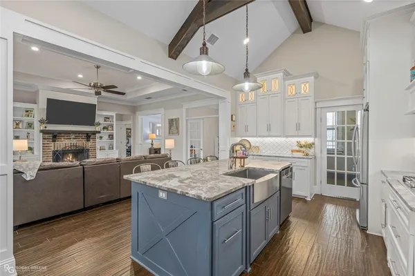 a kitchen with a stove sink and a refrigerator