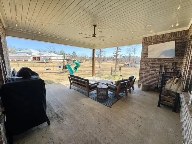 a bedroom with a bed dresser and a window