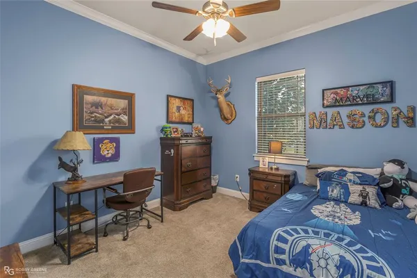a bedroom with furniture and a window