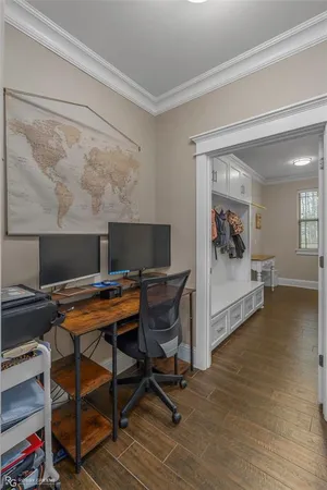 a workspace with furniture and wooden floor