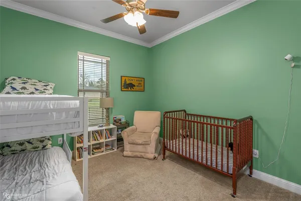 a bedroom with furniture and a chandelier