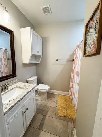 a bedroom with furniture and window