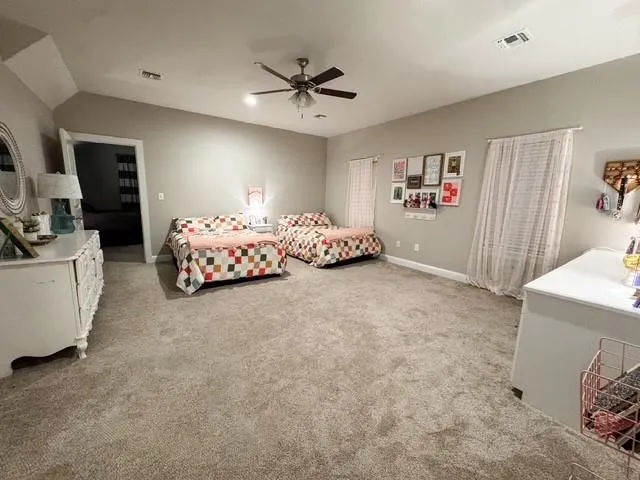 a bed room with furniture and a chandelier