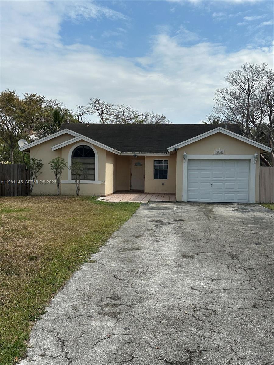 5861 Southwest 152nd Court Miami, FL 33193 - Photo 1 of 26 a front view of a house with garden