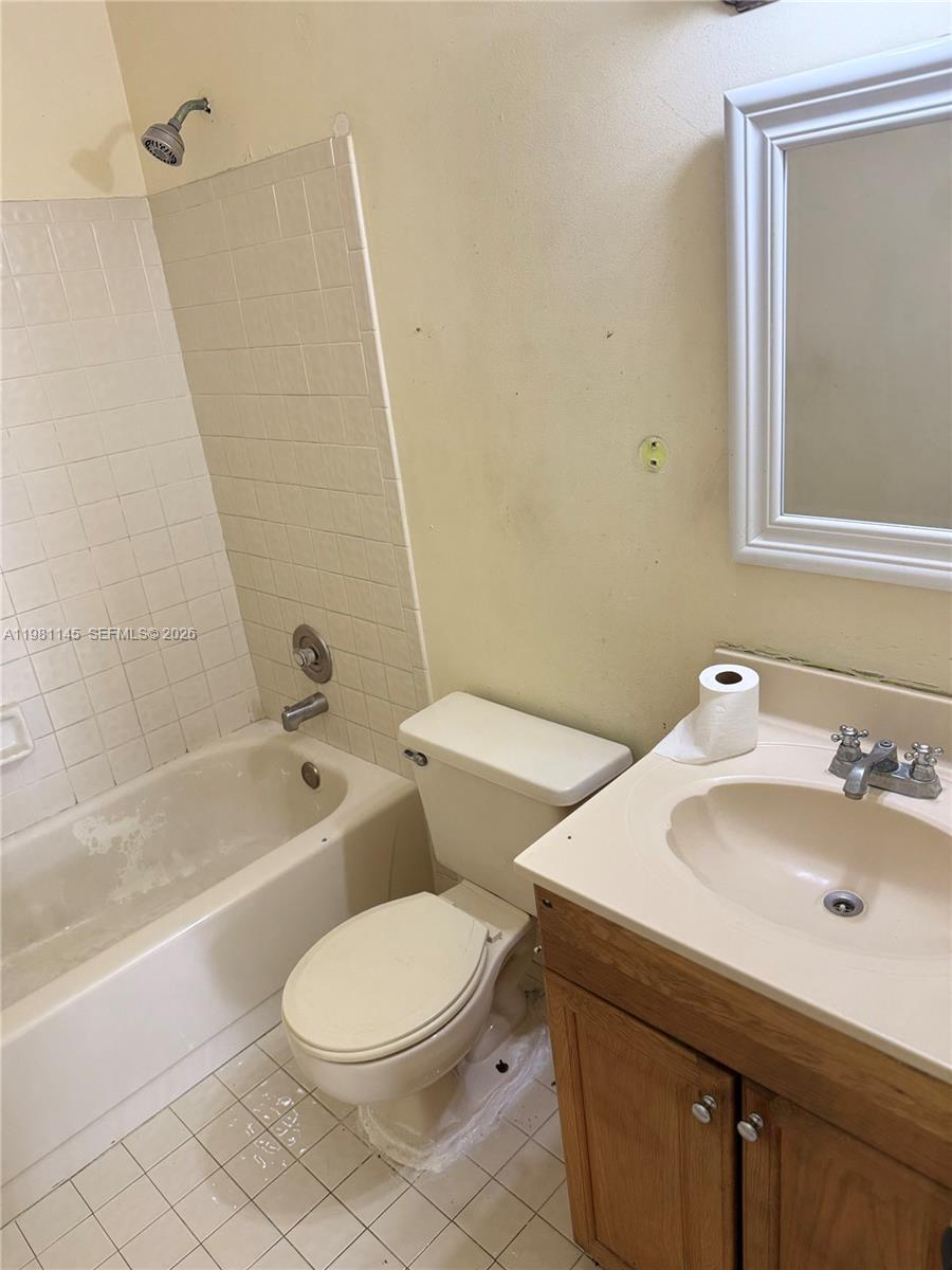 5861 Southwest 152nd Court Miami, FL 33193 - Photo 13 of 26 a bathroom with a sink a toilet and shower