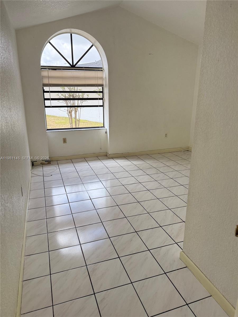 5861 Southwest 152nd Court Miami, FL 33193 - Photo 14 of 26 a view of an empty room with a window