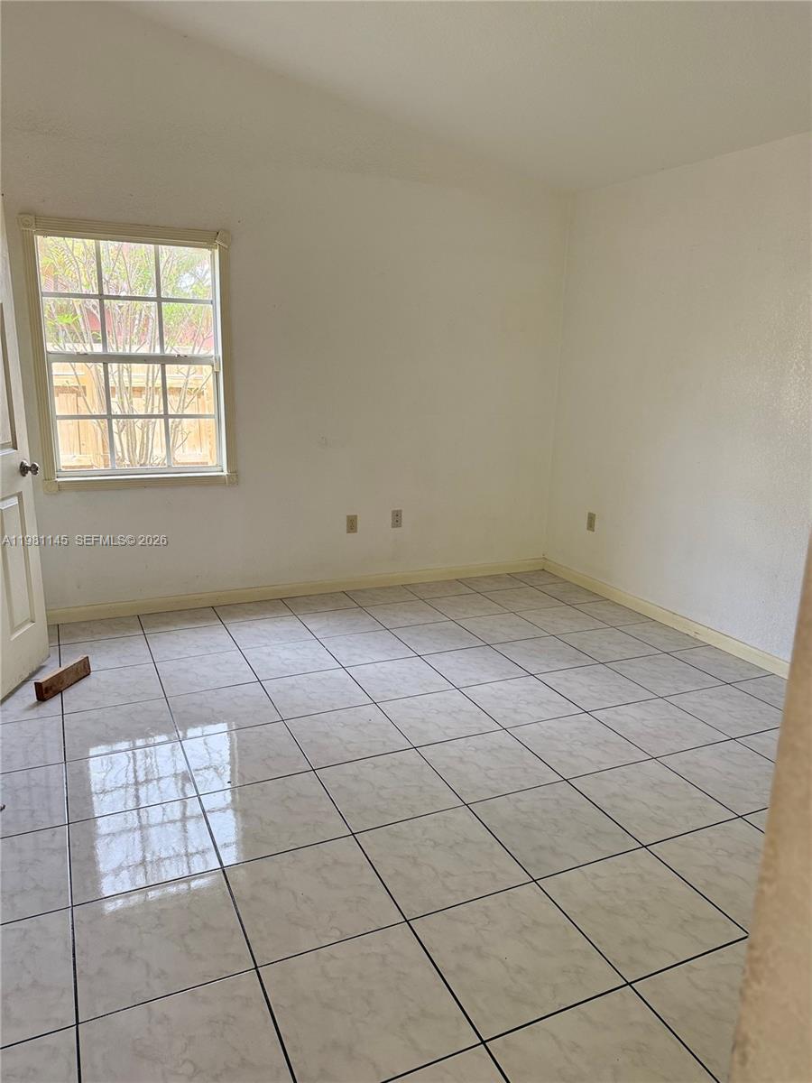 5861 Southwest 152nd Court Miami, FL 33193 - Photo 17 of 26 an empty room with windows