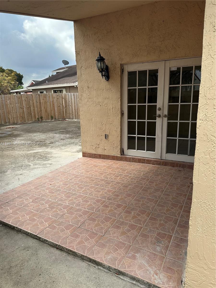 5861 Southwest 152nd Court Miami, FL 33193 - Photo 23 of 26 a view of a house with a large window