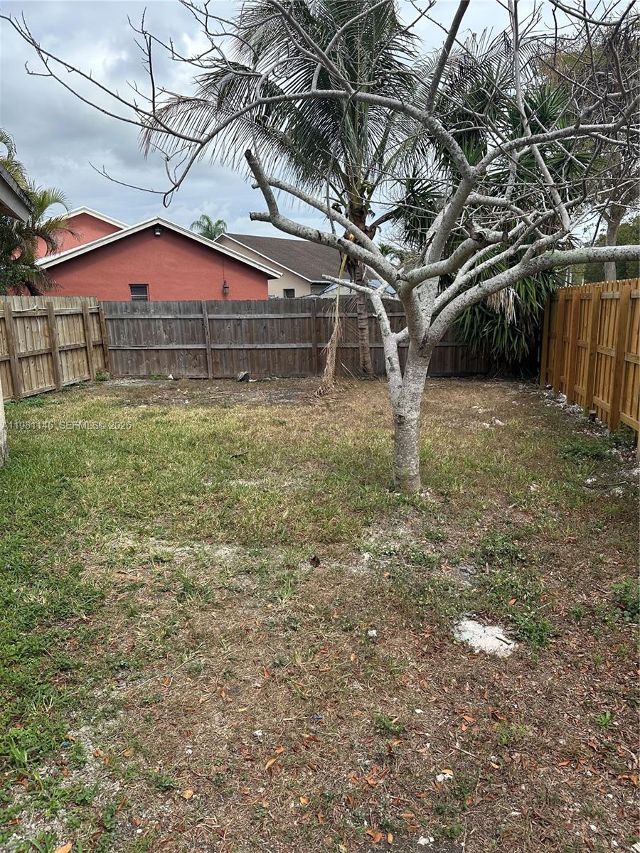 5861 Southwest 152nd Court Miami, FL 33193 - Photo 25 of 26 a front view of a house with a yard